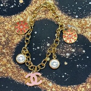 Chic Gold Tone CC Pink Charm Bracelet